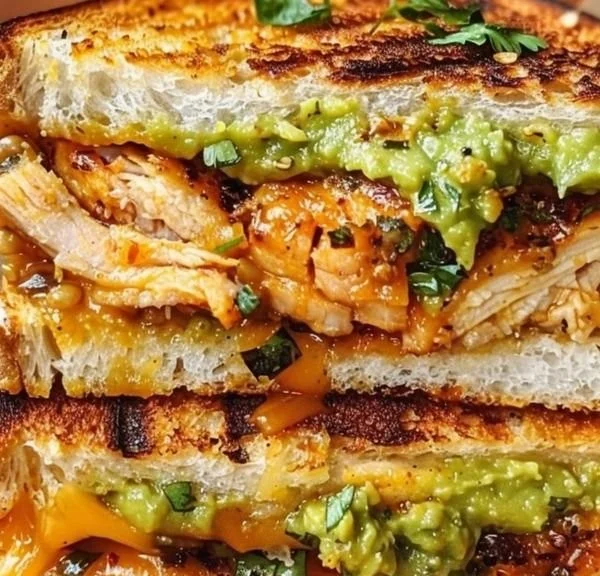 Delicious Chicken Avocado Melt Sandwich with melted cheese and fresh avocado.