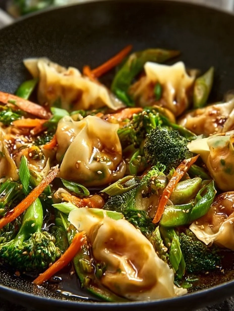 Colorful potsticker stir fry with vegetables in a wok.